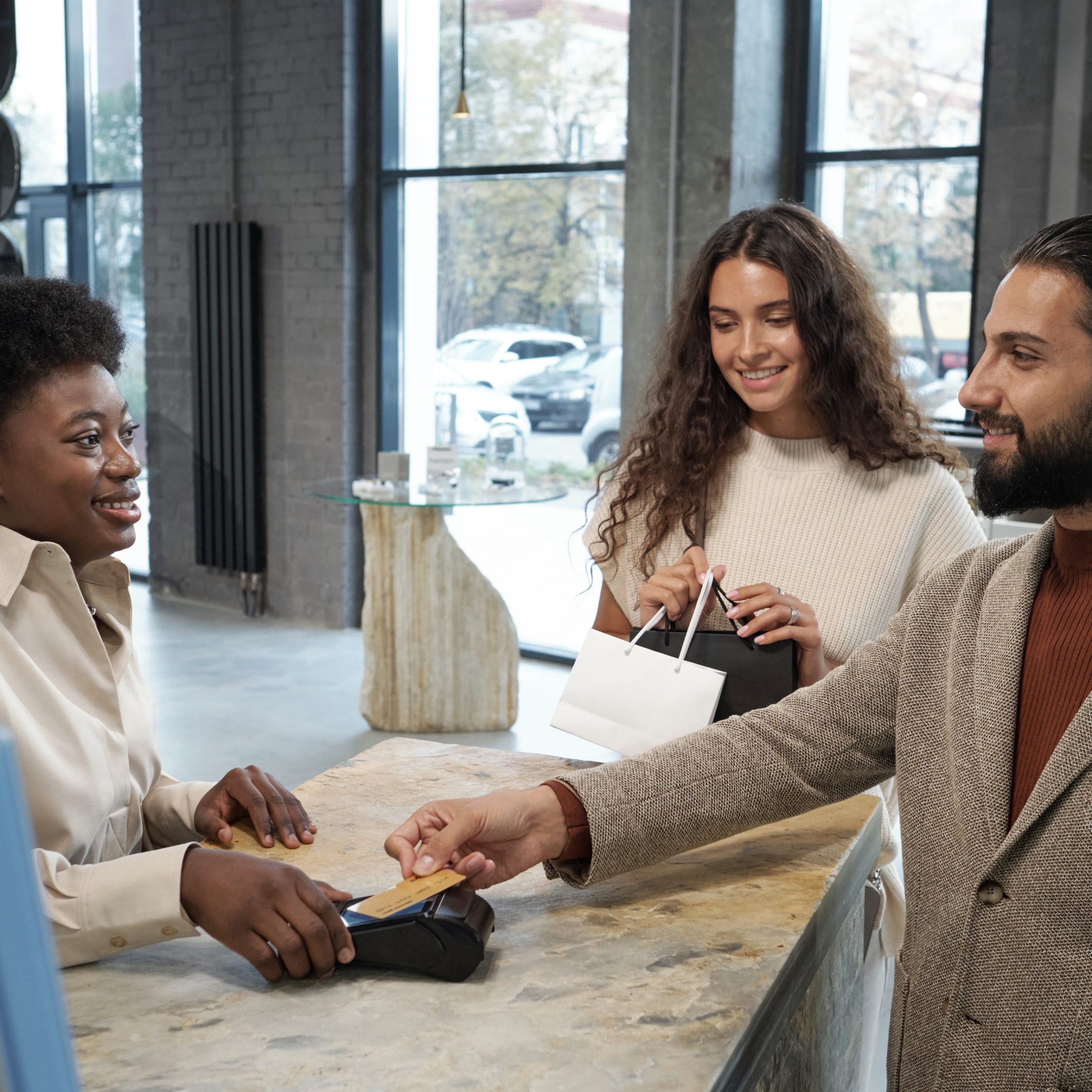 Sales associates serving a man